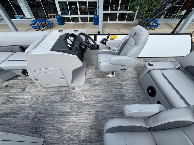 Slide: The Image of Interior of a 2027 Bentley Pontoons 200 Legacy Swingback with gray seating and modern helm. - 18