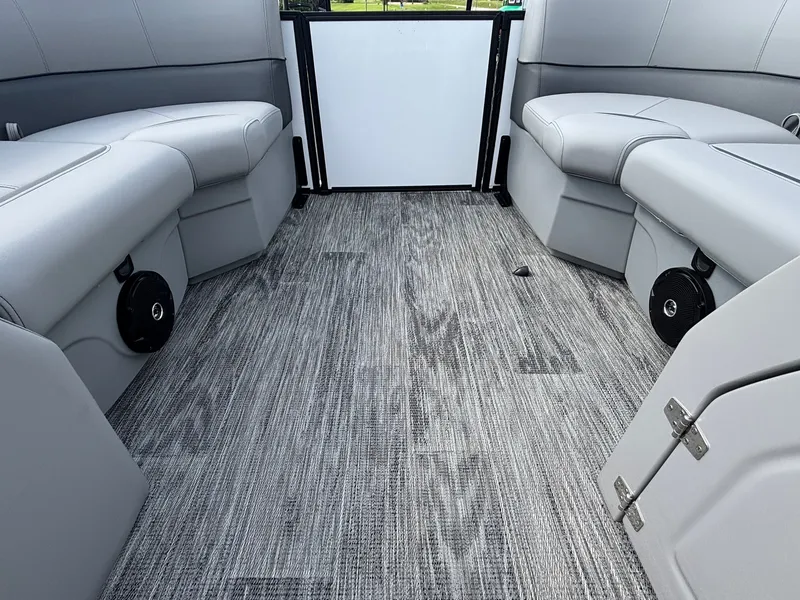 Slide: The Image of Interior of a 2027 Bentley Pontoons 200 Legacy Swingback with gray seating and wood-patterned flooring. - 15