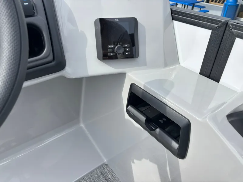 Slide: The Image of Close-up of the helm area of a Bentley Pontoons 200 Legacy Swingback with modern controls. - 23