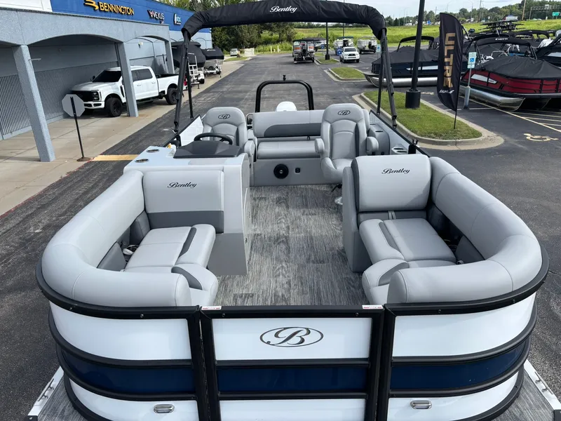 Slide: The Image of A 2027 Bentley Pontoons 200 Legacy Swingback with gray upholstery and an open deck layout. - 5