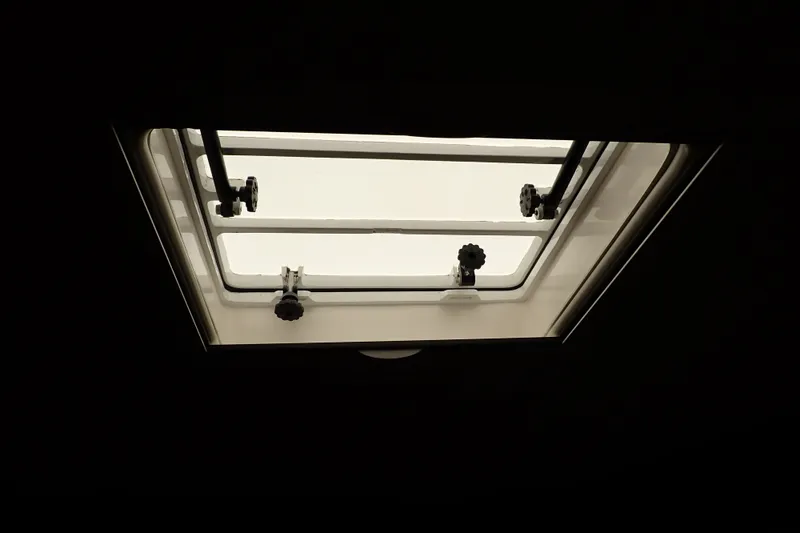 Slide: The Image of Open hatch on 2005 Bertram 390 boat, viewed from interior. - 90