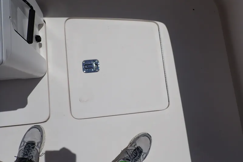 Slide: The Image of Deck of 2005 Bertram 390 boat with hatch and shoes visible. - 112