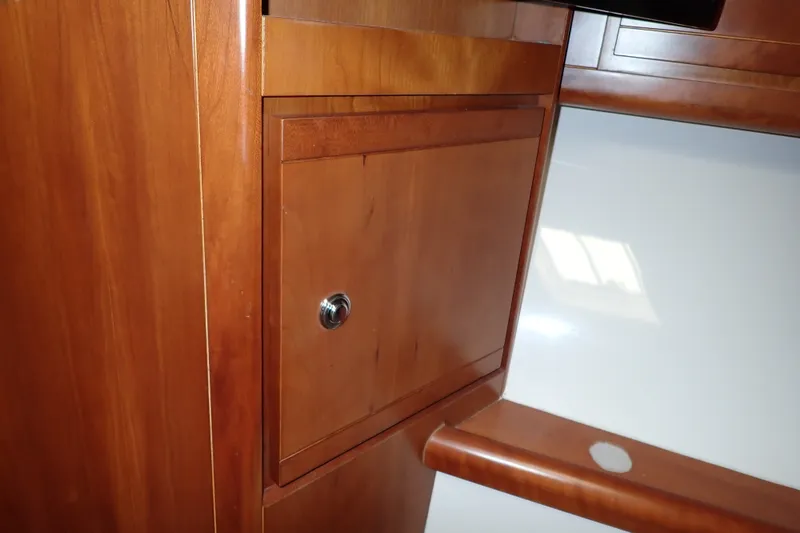 Slide: The Image of Wooden cabinet detail on a 2005 Bertram 390 yacht interior. - 87