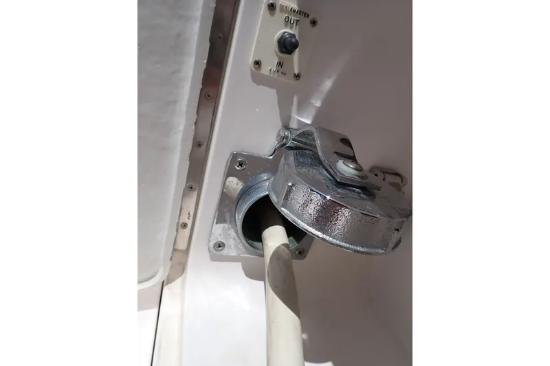 Slide: The Image of Fuel inlet on a 2005 Bertram 390 boat with a metallic cap. - 14