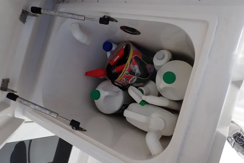 Slide: The Image of Storage compartment on a 2005 Bertram 390 boat with cleaning supplies. - 11