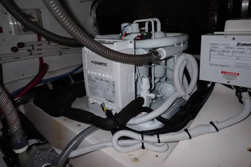 Slide: The Image of Engine room of a 2005 Bertram 390 with Dometic equipment and wiring. - 142