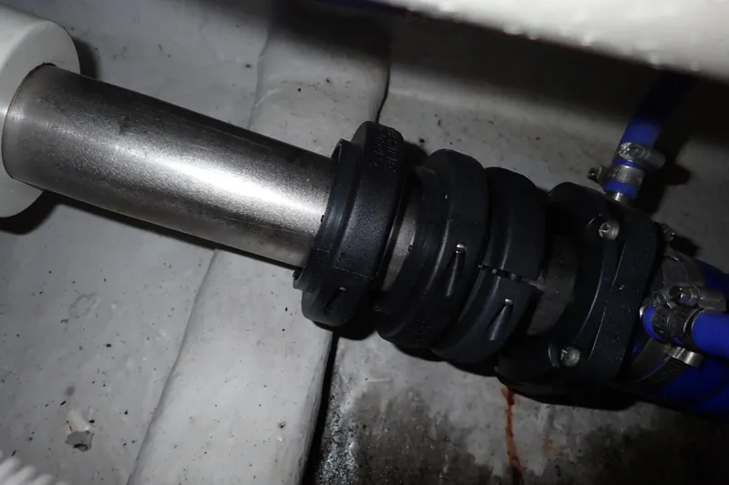 Slide: The Image of Close-up of a 2005 Bertram 390 boat's shaft seal and hose clamps. - 128