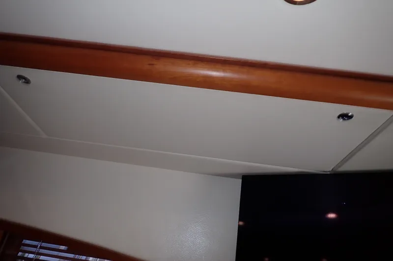 Slide: The Image of Interior ceiling of a 2005 Bertram 390 yacht with wood trim accents. - 79
