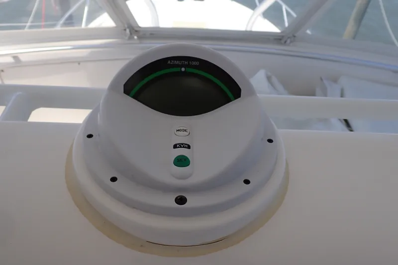 Slide: The Image of Azimuth 1000 compass on 2005 Bertram 390 yacht dashboard. - 48