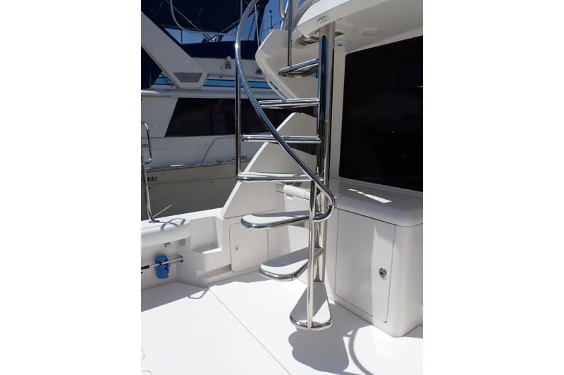 Slide: The Image of Stainless steel spiral staircase on a 2005 Bertram 390 yacht deck. - 24