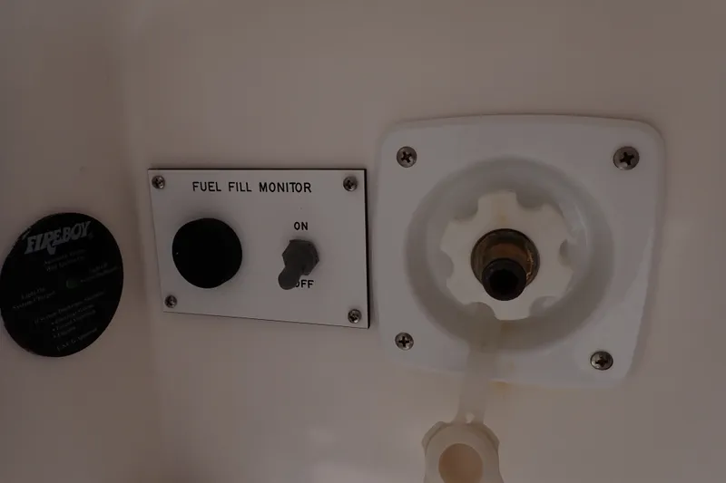 Slide: The Image of Fuel fill monitor and cap on 2005 Bertram 390 boat. - 15