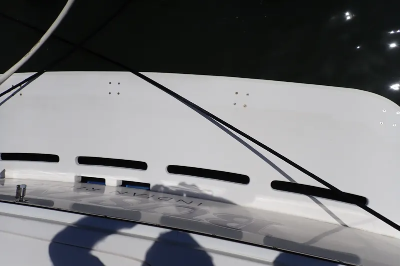 Slide: The Image of 2005 Bertram 390 boat deck with shadows and water reflections. - 116