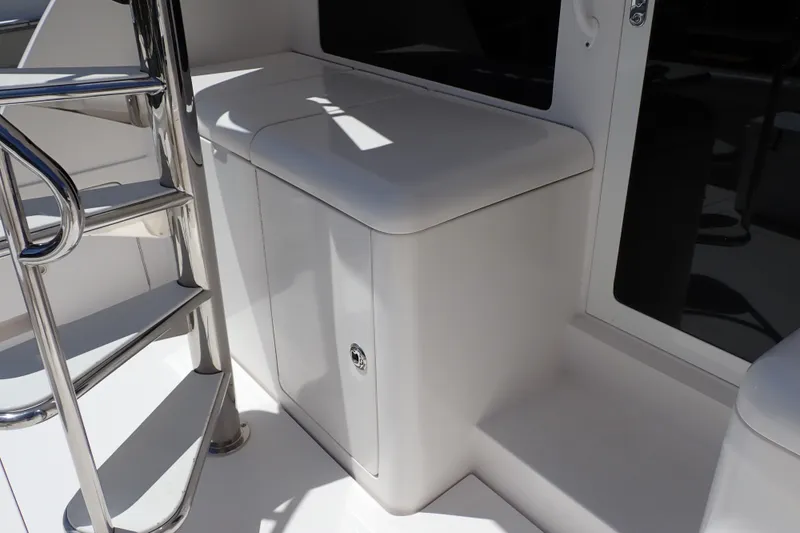 Slide: The Image of Stainless steel ladder and storage compartment on a 2005 Bertram 390 yacht. - 22
