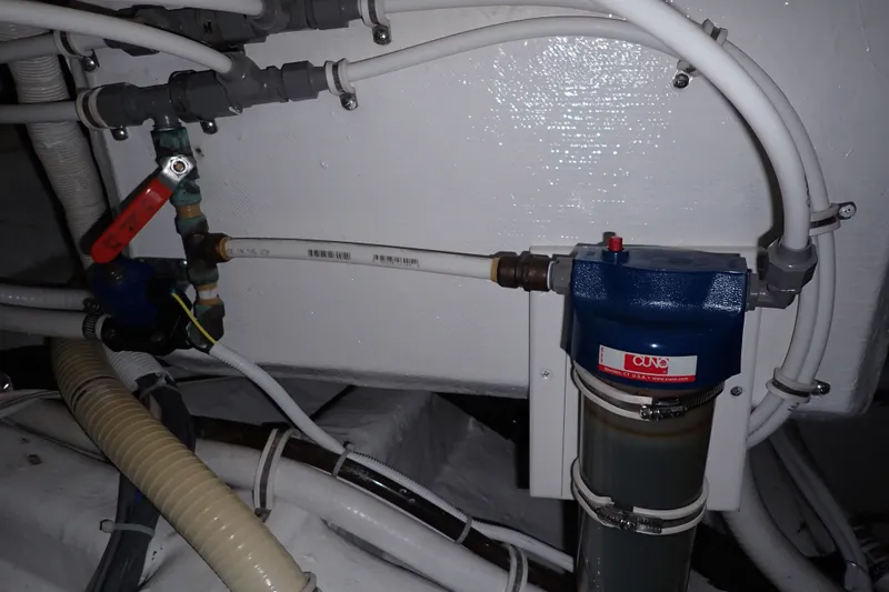 Slide: The Image of Engine room plumbing and filtration system in a 2005 Bertram 390 boat. - 104