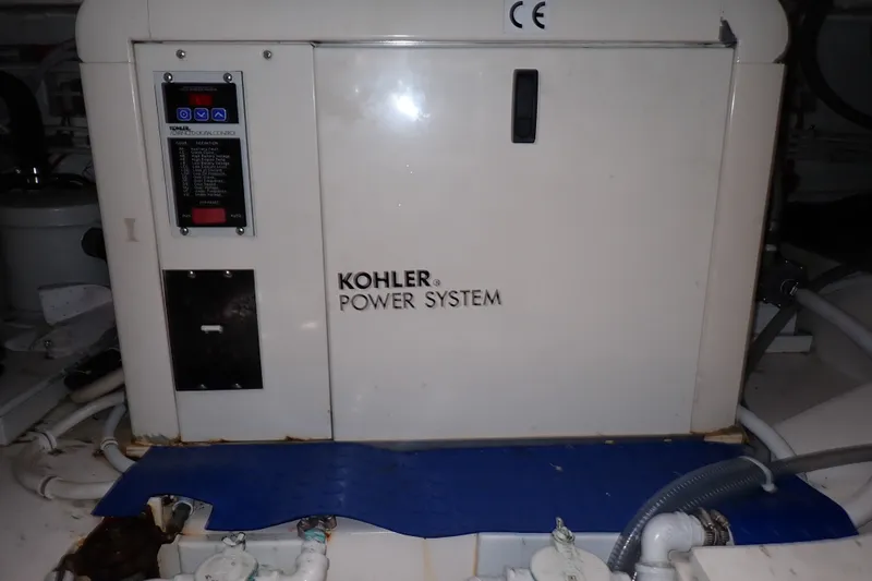 Slide: The Image of Kohler power system in a 2005 Bertram 390 yacht engine room. - 140