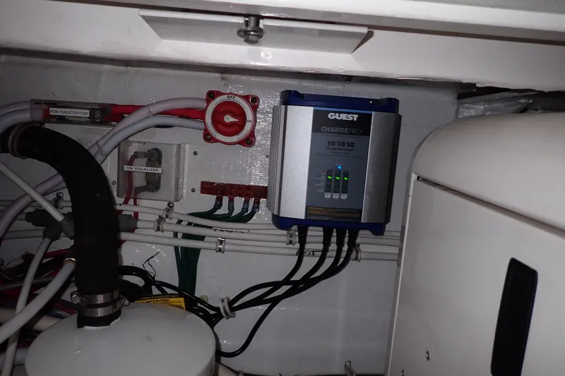 Slide: The Image of Electrical system setup in a 2005 Bertram 390 boat engine room. - 133
