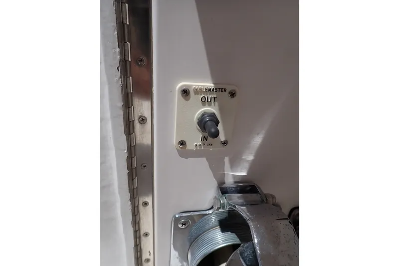Slide: The Image of Toggle switch labeled "Cablemaster" on a 2005 Bertram 390 boat. - 13