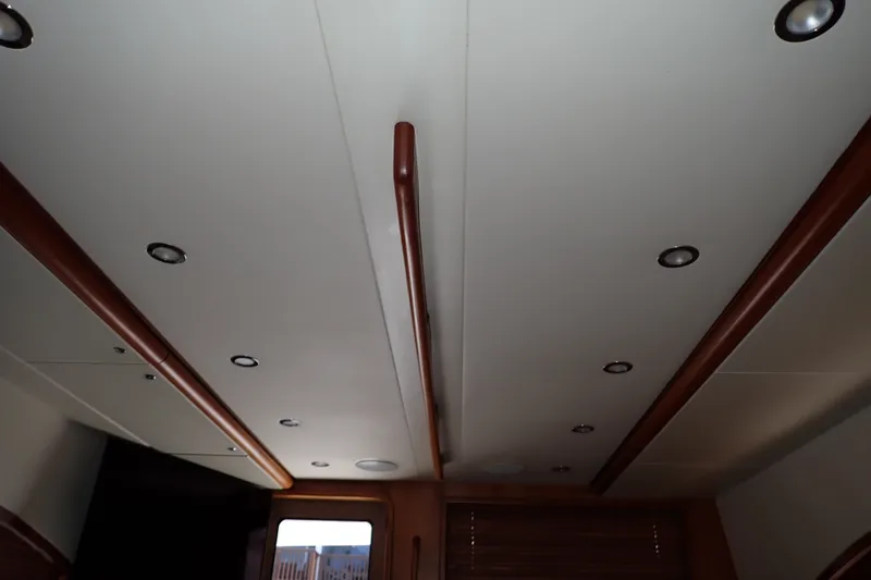 Slide: The Image of Interior ceiling of a 2005 Bertram 390 yacht with recessed lighting. - 81
