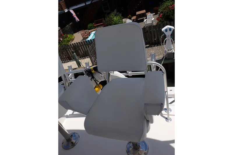 Slide: The Image of Captain's chair on 2005 Bertram 390 yacht, dockside view. - 39