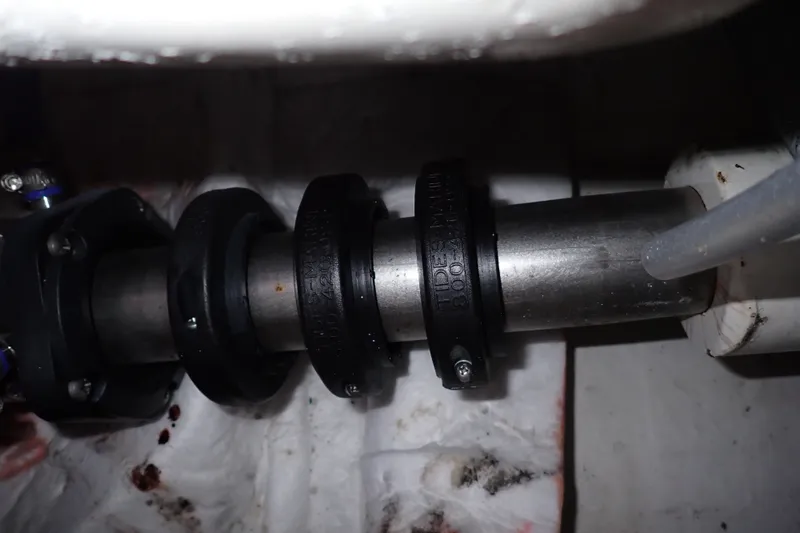 Slide: The Image of Close-up of a 2005 Bertram 390 boat shaft with seals and fittings. - 126