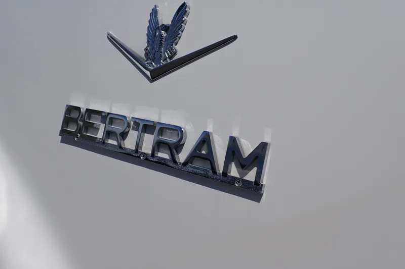 Slide: The Image of Bertram 390 emblem on 2005 model boat, featuring sleek metallic design. - 27