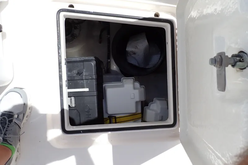 Slide: The Image of Storage compartment on a 2005 Bertram 390 boat, containing equipment and accessories. - 113