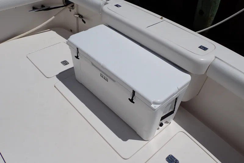 Slide: The Image of White Yeti cooler on 2005 Bertram 390 boat deck, showcasing storage features. - 20