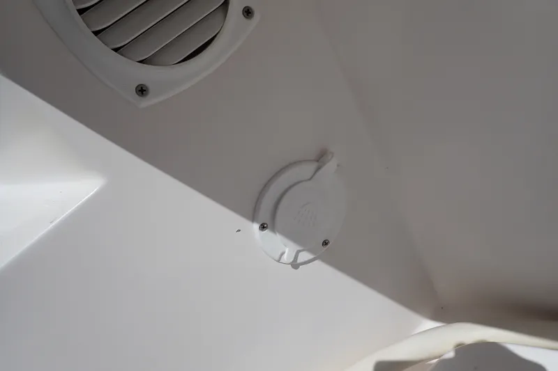 Slide: The Image of 2005 Bertram 390 boat interior detail with vent and circular fixture. - 108