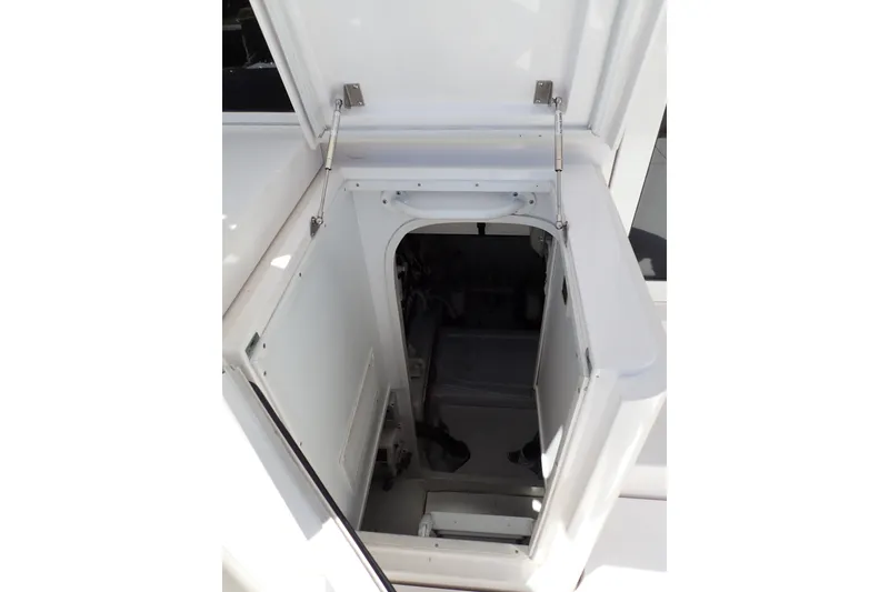 Slide: The Image of Open hatch on a 2005 Bertram 390 boat, revealing interior access. - 123