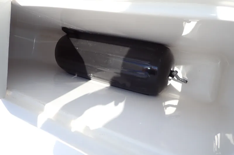 Slide: The Image of Boat fender stored in a compartment on a 2005 Bertram 390 yacht. - 115