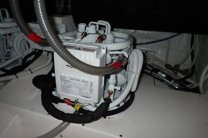 Slide: The Image of Engine room of a 2005 Bertram 390 boat with Dometic equipment. - 144