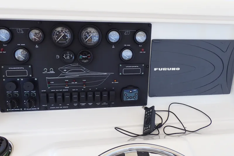 Slide: The Image of Control panel of a 2005 Bertram 390 boat with Furuno navigation system. - 40