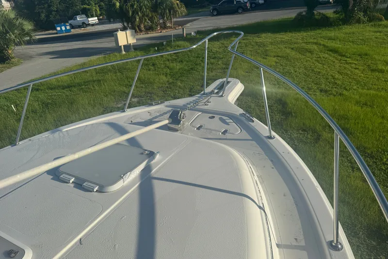 Slide: The Image of Bow view of 2006 Pro-Line 35 Express boat on grassy area. - 33