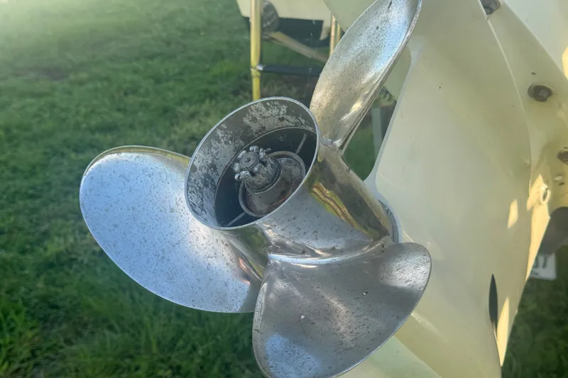 Slide: The Image of Close-up of a 2006 Pro-Line 35 Express boat propeller on grass. - 22