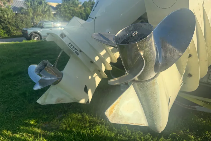 Slide: The Image of Close-up of 2006 Pro-Line 35 Express boat propellers on grass. - 23