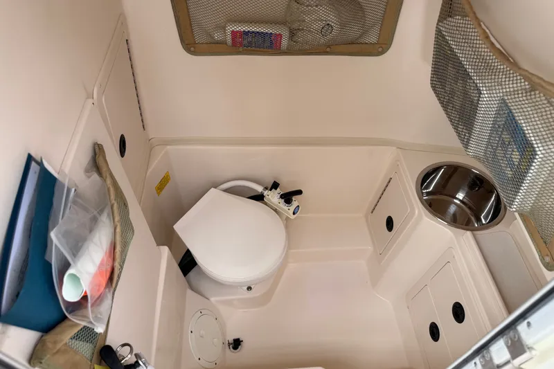 Slide: The Image of Interior of 2002 Grady White 273 Chase boat with compact marine toilet. - 18