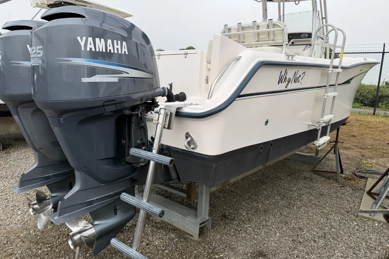 Slide: The Image of 2002 Grady White 273 Chase boat with twin Yamaha 225 engines on a trailer. - 22