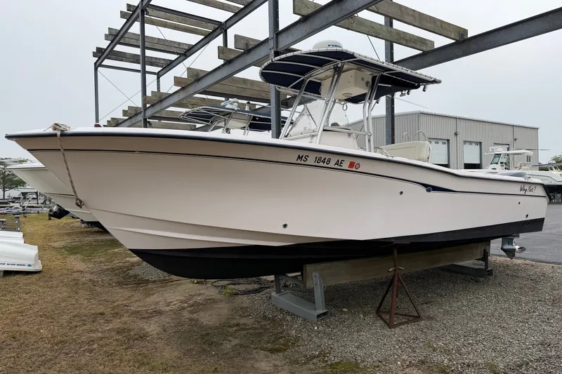 The Image of 2002 Grady White 273 Chase boat on display in a marina storage area. - 1