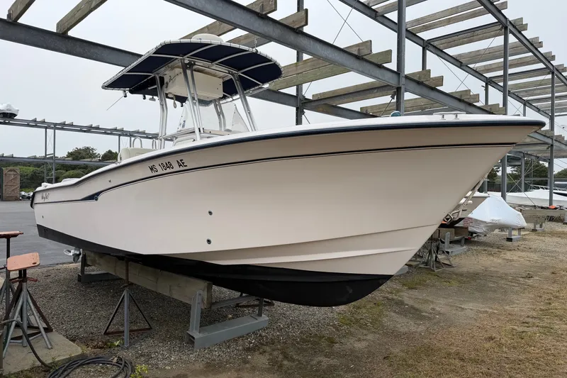 Slide: The Image of 2002 Grady White 273 Chase boat on dry dock, showcasing sleek design and sturdy build. - 3