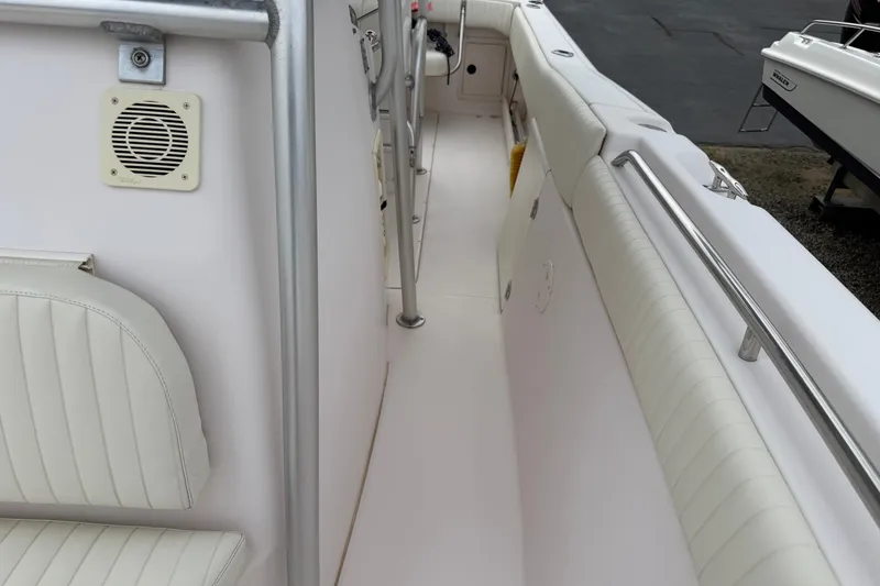Slide: The Image of 2002 Grady White 273 Chase boat interior with white seating and stainless steel railings. - 17