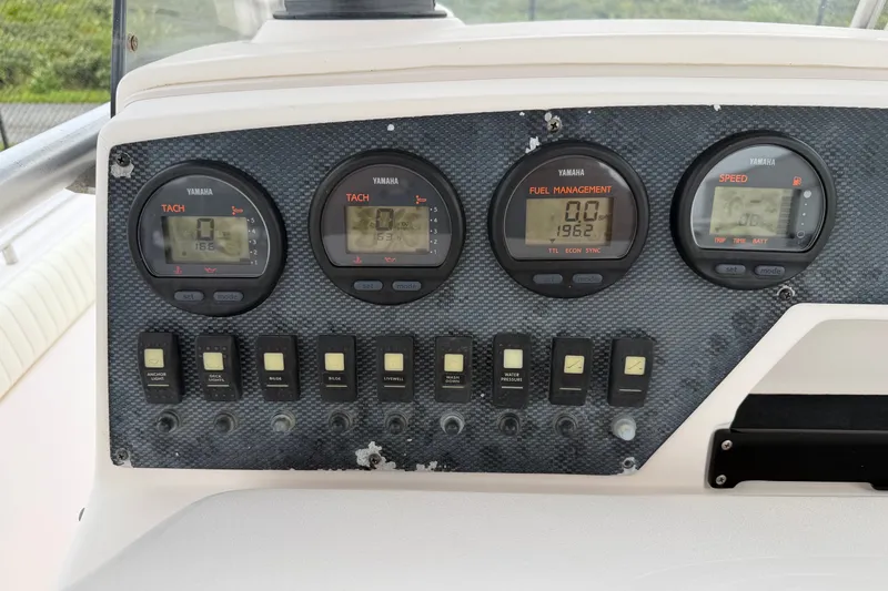 Slide: The Image of Dashboard of a 2002 Grady White 273 Chase boat with Yamaha gauges and switches. - 12