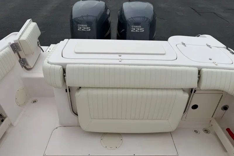 Slide: The Image of 2002 Grady White 273 Chase boat with Yamaha 225 engines, featuring white cushioned seating. - 20