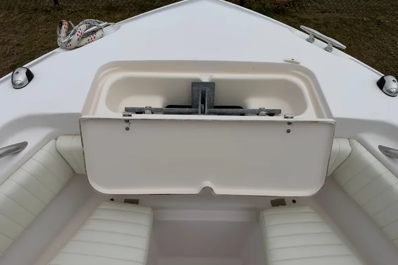Slide: The Image of Bow seating area of a 2002 Grady White 273 Chase boat with storage compartment. - 5