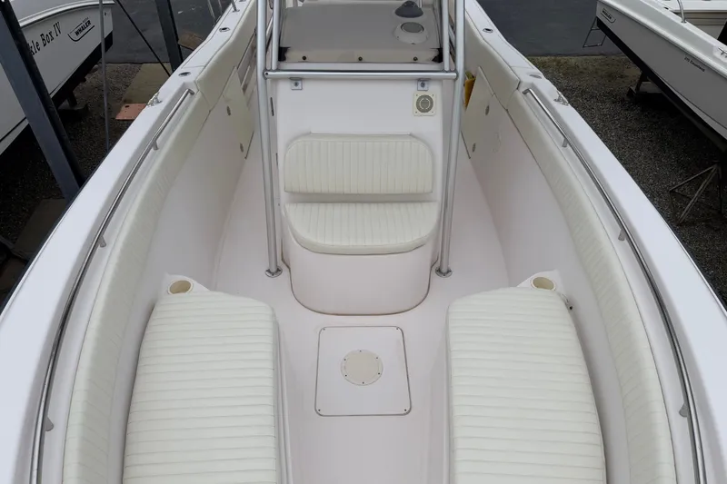 Slide: The Image of 2002 Grady White 273 Chase boat interior with white seating and clean deck. - 7