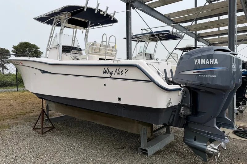 Slide: The Image of 2002 Grady White 273 Chase boat with Yamaha engine on display. - 2