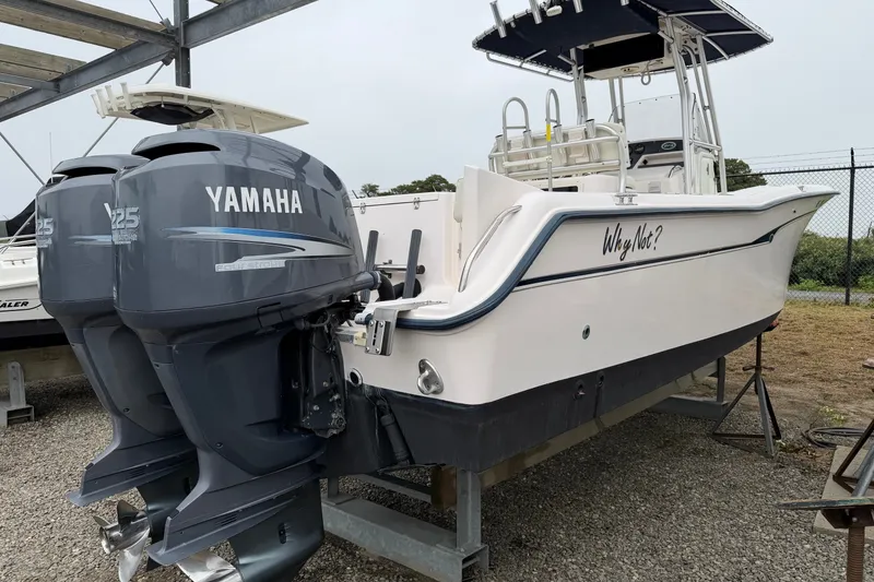 Slide: The Image of 2002 Grady White 273 Chase boat with twin Yamaha 225 engines on display. - 4