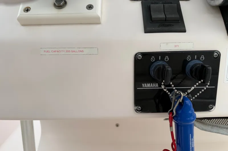 Slide: The Image of Control panel of a 2002 Grady White 273 Chase boat with Yamaha ignition switches. - 14