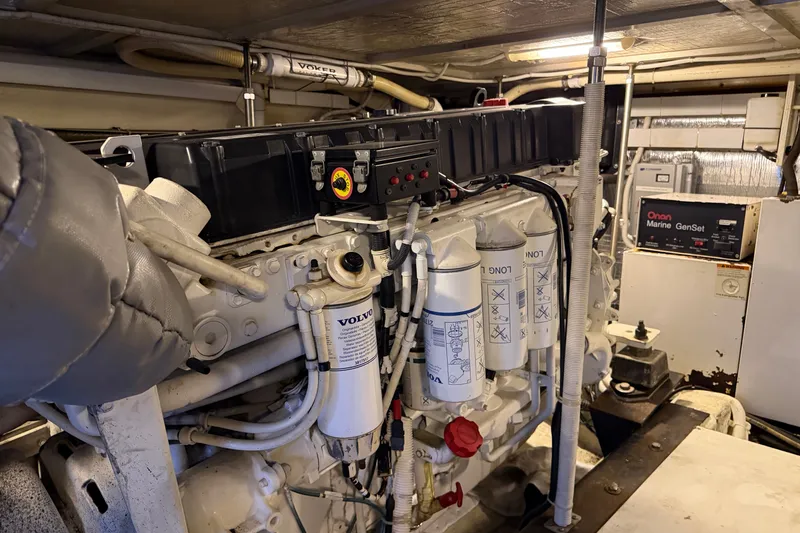 Slide: The Image of Engine room of a 2002 Carver 570 Voyager Pilothouse with Volvo components and Onan Marine GenSet. - 17