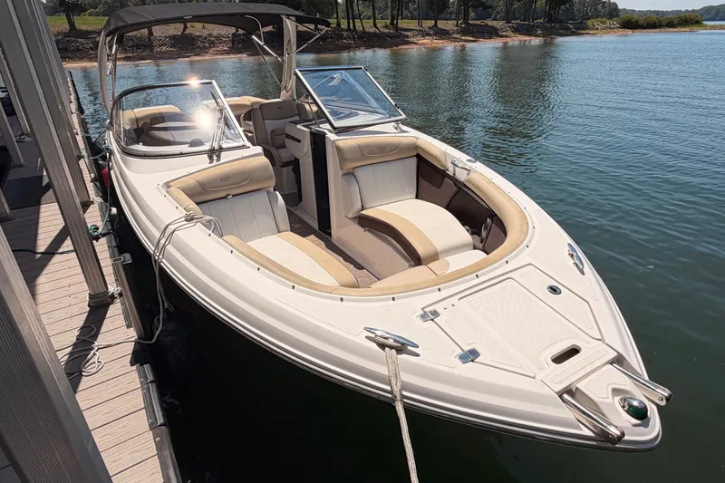 The Image of 2017 Regal 2700 ES Bowrider docked on a serene lake. - 0