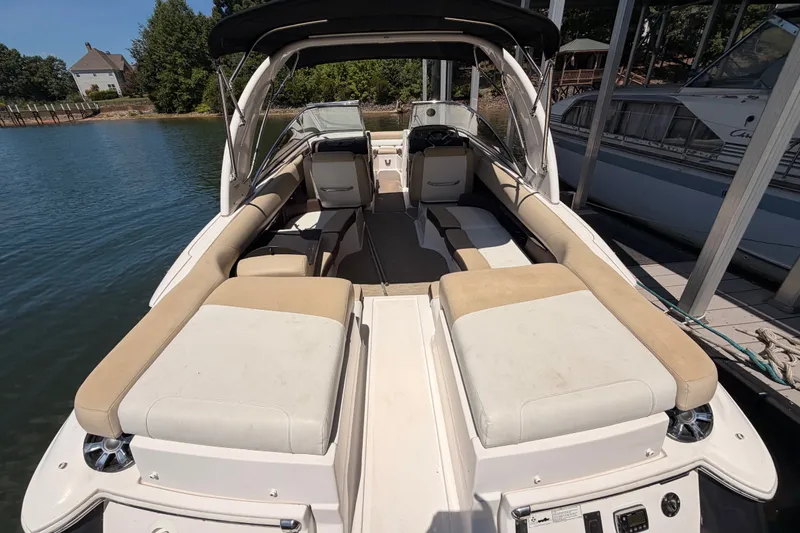 Slide: The Image of 2017 Regal 2700 ES Bowrider docked, featuring spacious seating and sleek design. - 6